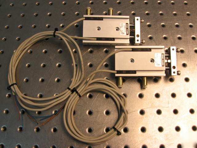 G37579 two smc CXSM10-20 pneumatic actuators